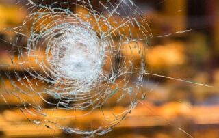 Service Insurance Group Company. in Bryan TX - Image of a broken glass