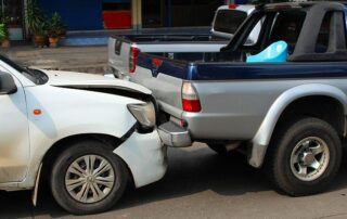A car accident with a wrecked pickup.