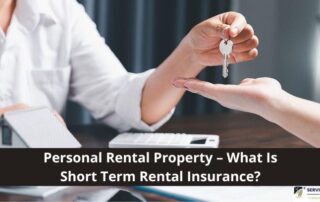 Person hands over house keys to another person at a desk with documents and a calculator; text reads, Personal Rental Property – What Is Short Term Rental Insurance?.