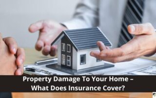 A person in business attire discusses home insurance with a model house and documents on a desk; text reads, Property Damage To Your Home – What Does Insurance Cover?.